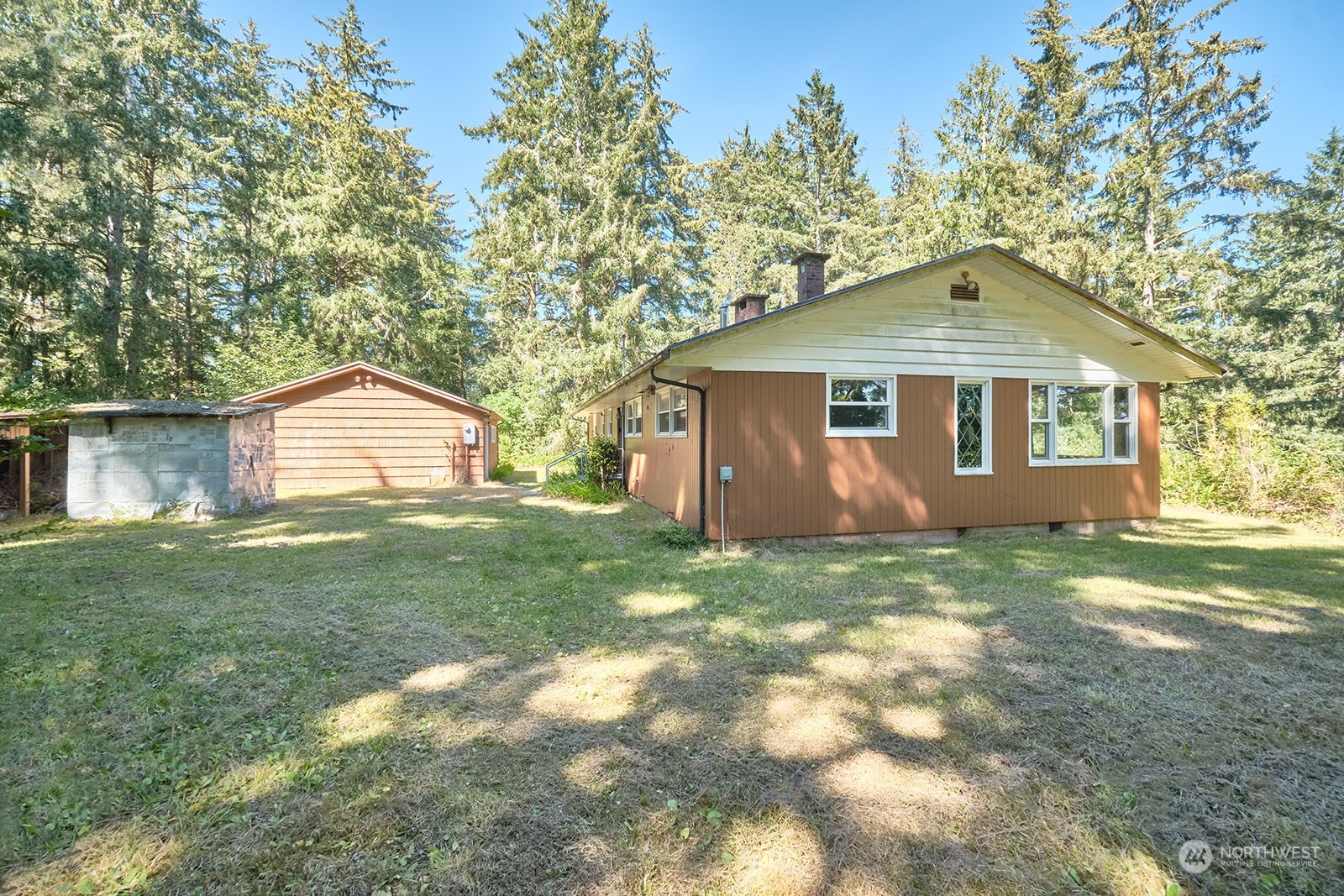 30708 Sandridge Road Ocean Park, WA 98640 - Photo 24 of 37 a front view of a house with a garden