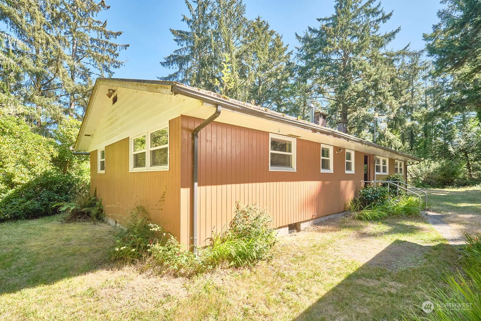 30708 Sandridge Road Ocean Park, WA 98640 - Photo 6 of 37 a front view of a house with a yard
