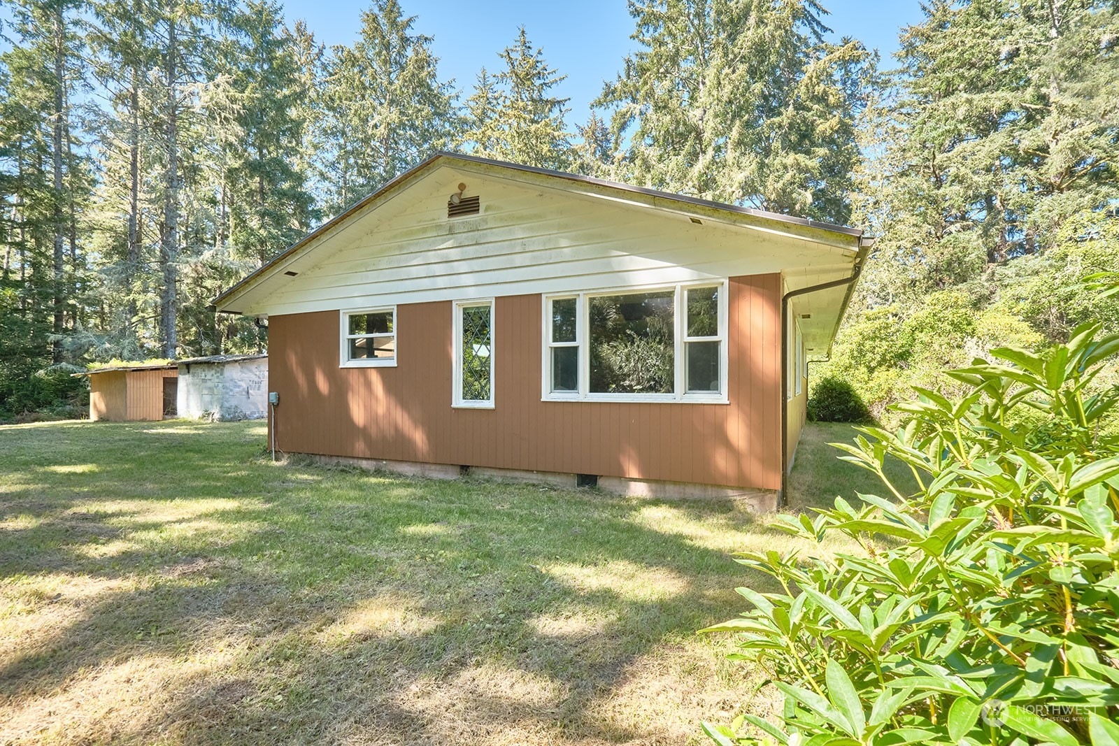 30708 Sandridge Road Ocean Park, WA 98640 - Photo 7 of 37 a view of a house with yard and garden