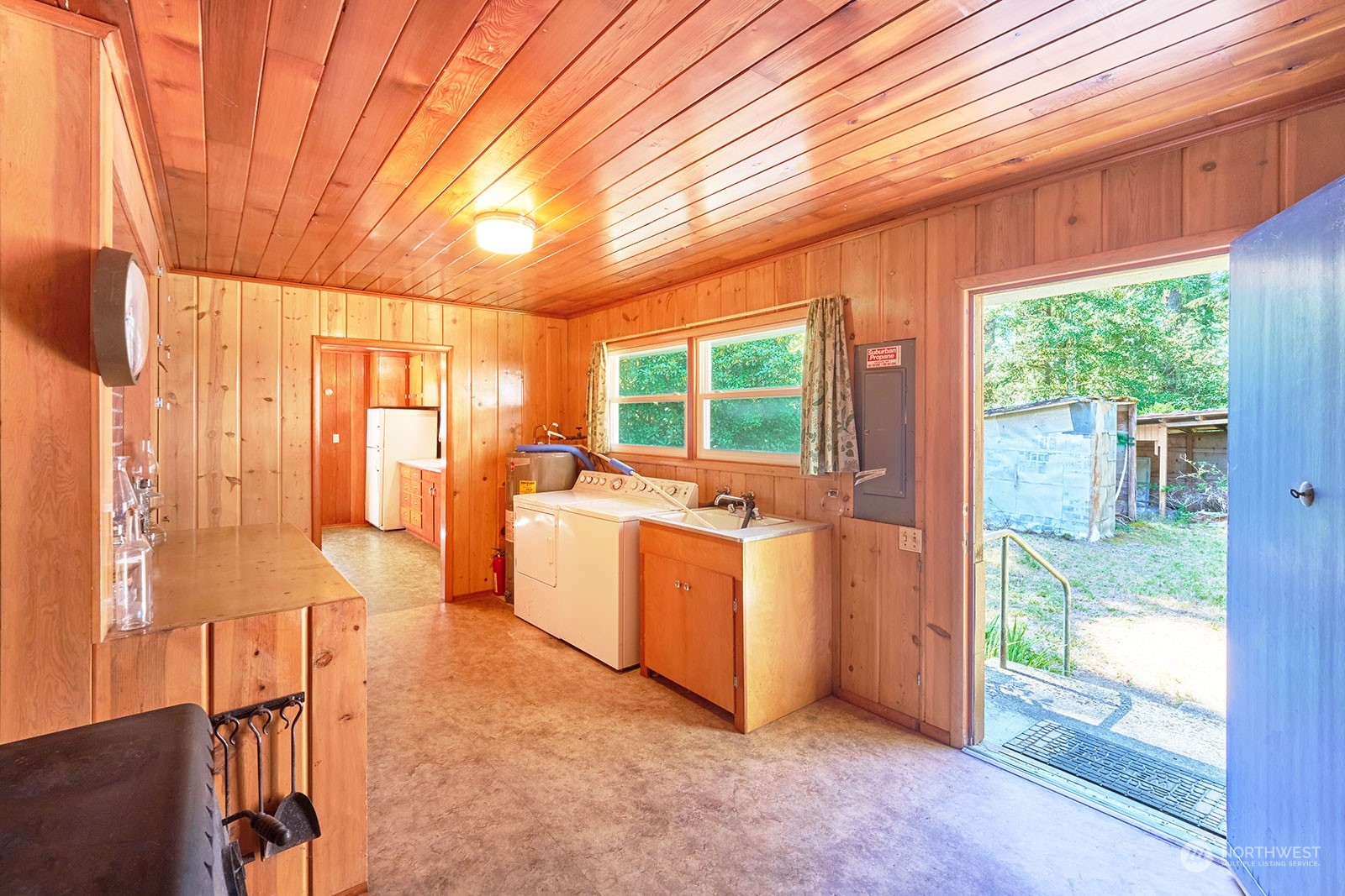 30708 Sandridge Road Ocean Park, WA 98640 - Photo 8 of 37 a view of living room kitchen with furniture and large window