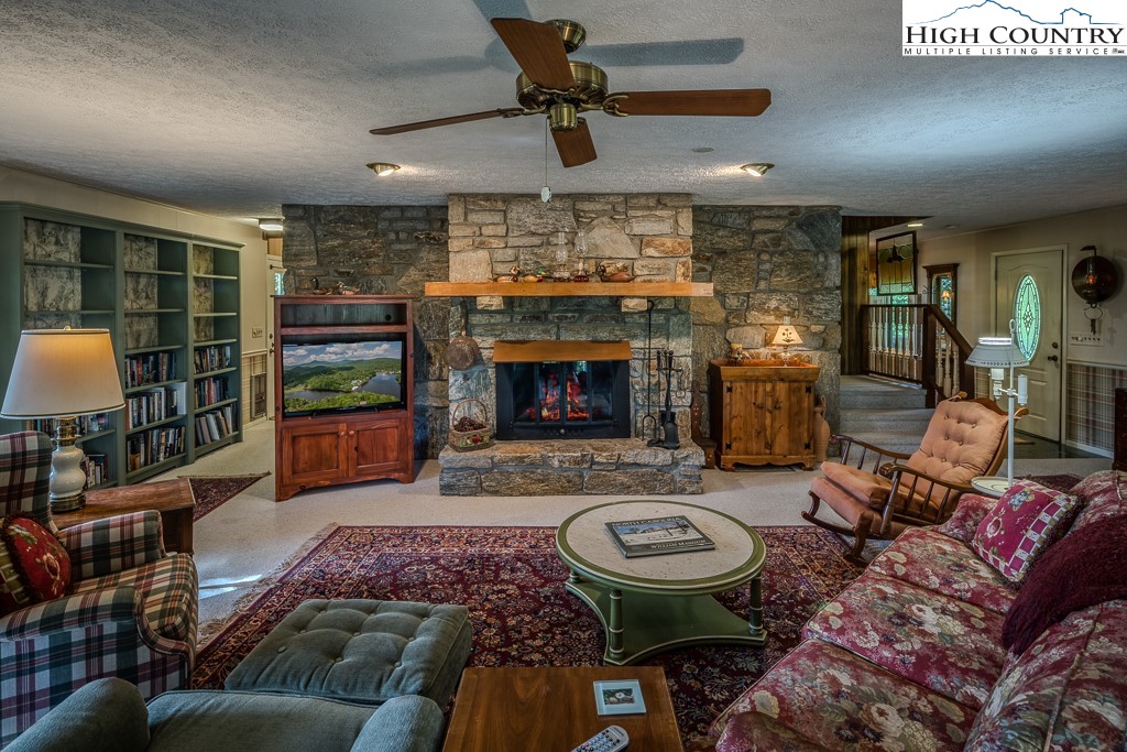 94 Rhododendron Loop Newland, NC 28657 - Photo 14 of 50 a living room with furniture and a fireplace