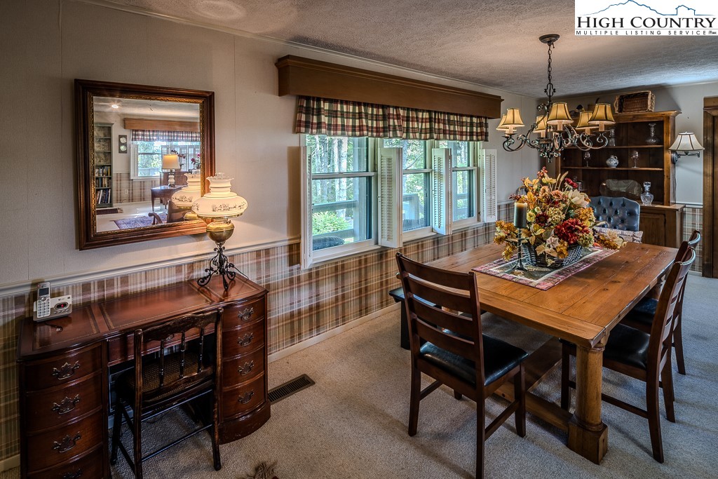 94 Rhododendron Loop Newland, NC 28657 - Photo 18 of 50 a dining room with furniture and window
