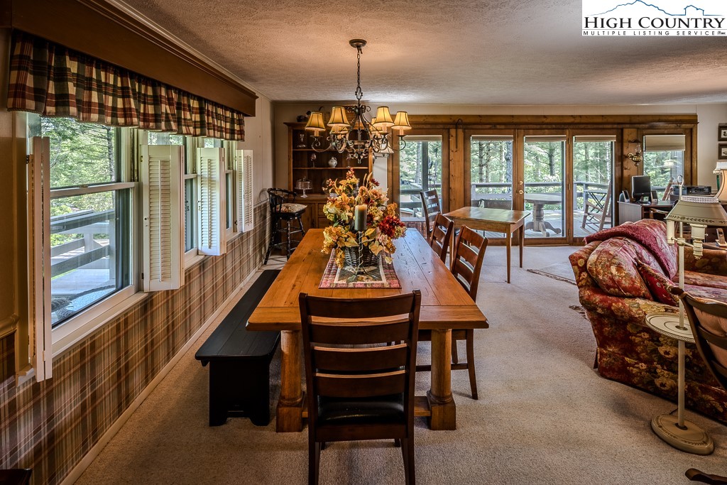 94 Rhododendron Loop Newland, NC 28657 - Photo 19 of 50 a room with gym equipment and a large window