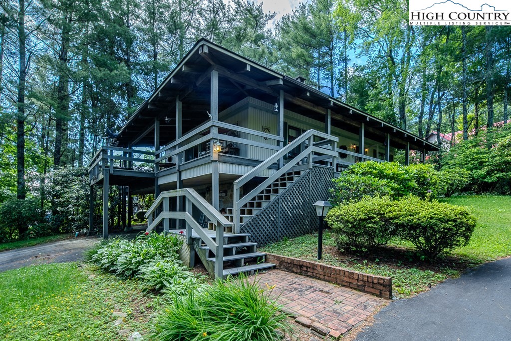94 Rhododendron Loop Newland, NC 28657 - Photo 2 of 50 a front view of a house with a yard