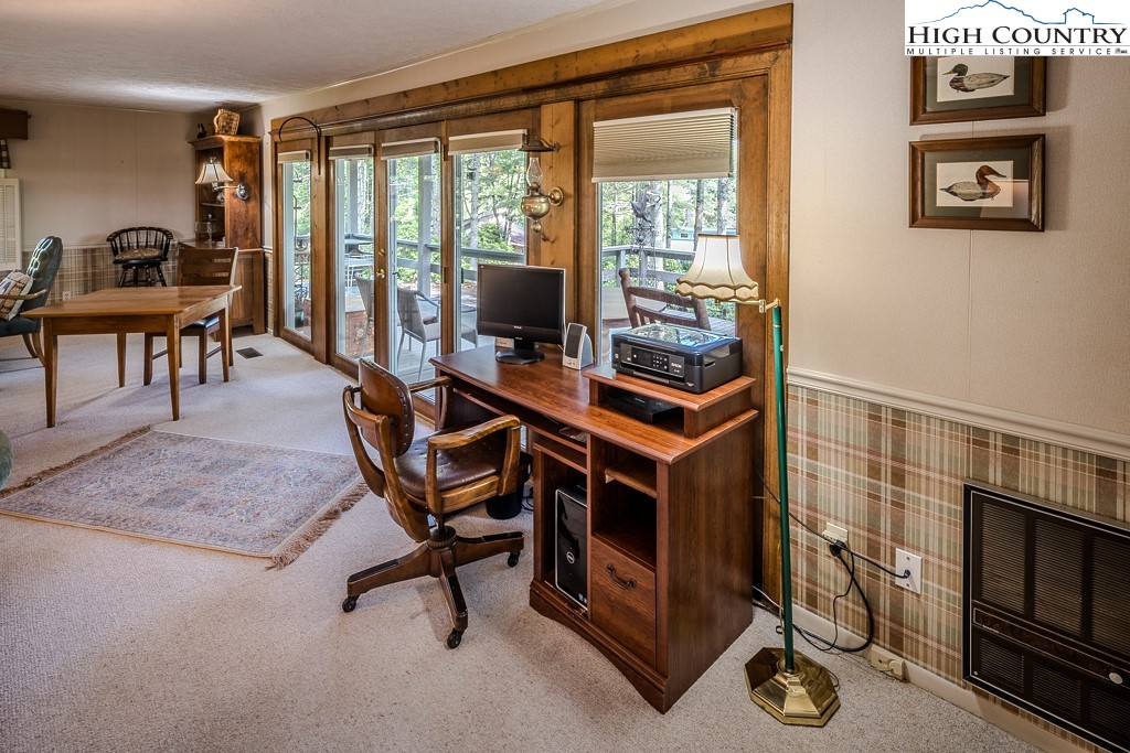 94 Rhododendron Loop Newland, NC 28657 - Photo 22 of 50 a work room with furniture and a floor to ceiling window