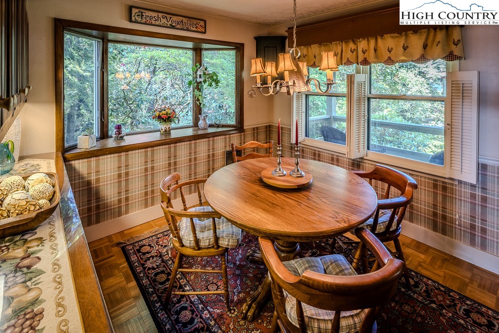 94 Rhododendron Loop Newland, NC 28657 - Photo 23 of 50 a view of a dining room with furniture window and outside view