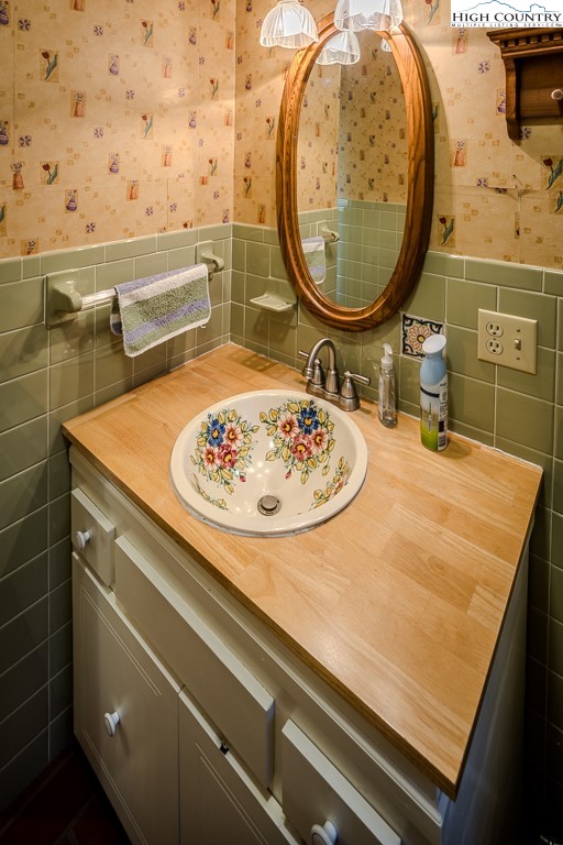 94 Rhododendron Loop Newland, NC 28657 - Photo 27 of 50 a bathroom with a sink and a mirror