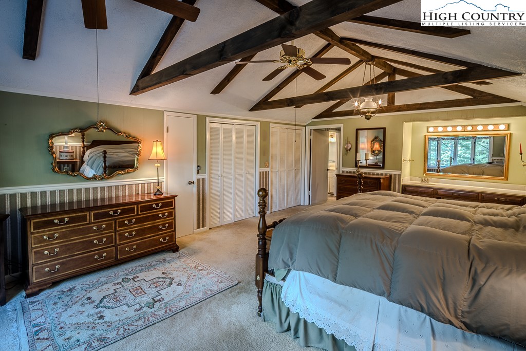 94 Rhododendron Loop Newland, NC 28657 - Photo 32 of 50 a bed room with a bed and a dresser