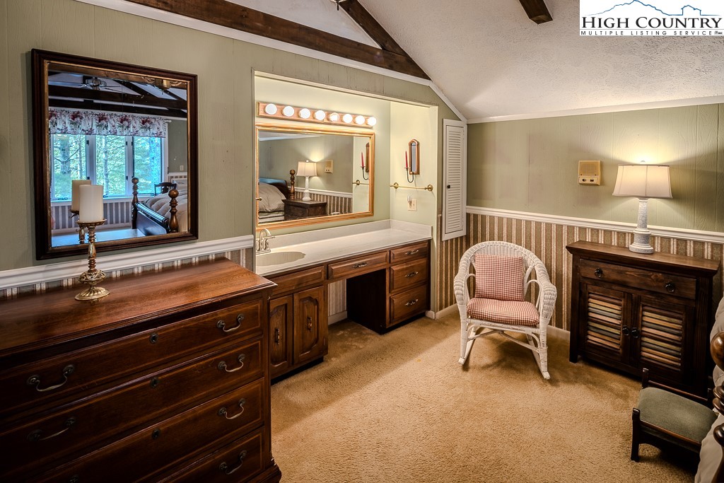 94 Rhododendron Loop Newland, NC 28657 - Photo 33 of 50 a living room with furniture a fireplace and large windows