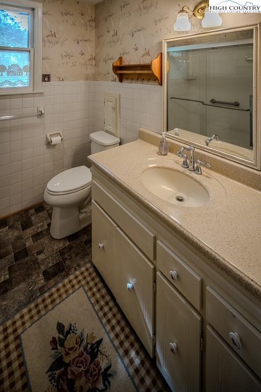 94 Rhododendron Loop Newland, NC 28657 - Photo 36 of 50 a bathroom with a sink and a mirror