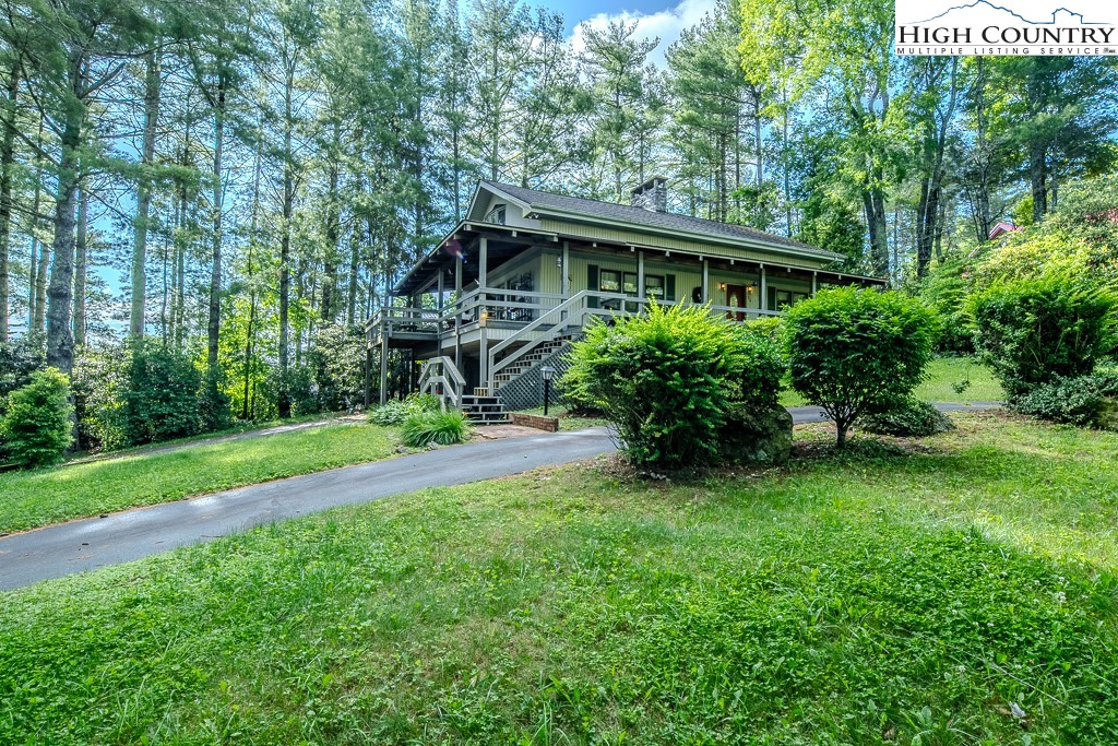 94 Rhododendron Loop Newland, NC 28657 - Photo 4 of 50 a front view of house with yard and green space