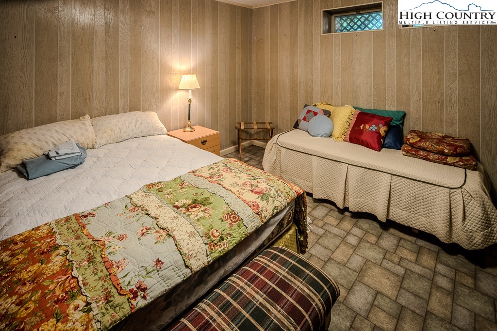 94 Rhododendron Loop Newland, NC 28657 - Photo 42 of 50 a bedroom with bed and window