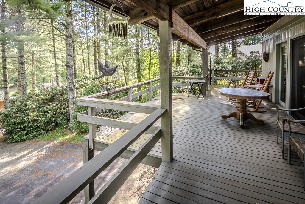 94 Rhododendron Loop Newland, NC 28657 - Photo 5 of 50 a view of a chairs and table in the balcony