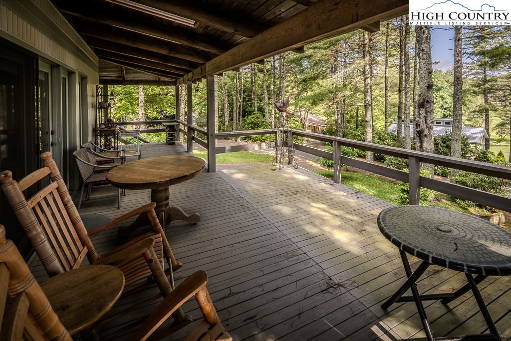 94 Rhododendron Loop Newland, NC 28657 - Photo 7 of 50 a view of a chairs and table in the patio