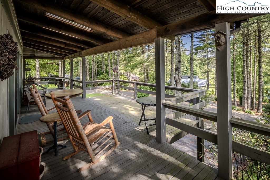 94 Rhododendron Loop Newland, NC 28657 - Photo 8 of 50 a view of a porch with furniture and a yard