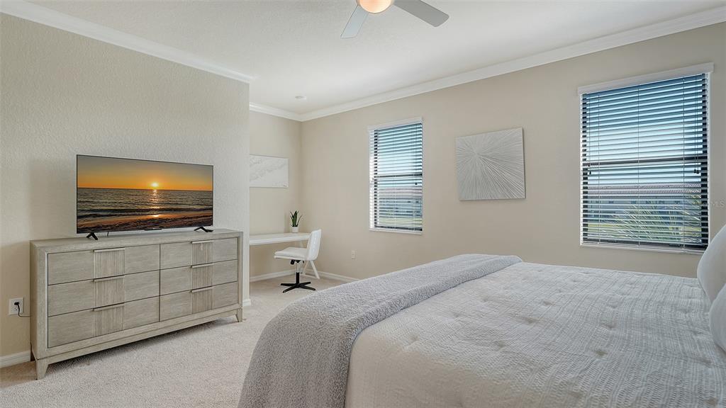 20223 Lagente Circle Venice, FL 34293 - Photo 18 of 71 a bedroom with a flat screen tv and a window