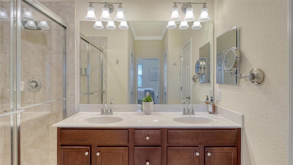 20223 Lagente Circle Venice, FL 34293 - Photo 21 of 71 a bathroom with a sink double vanity and a mirror