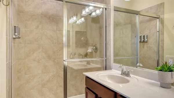 a bathroom with a sink a vanity and a mirror