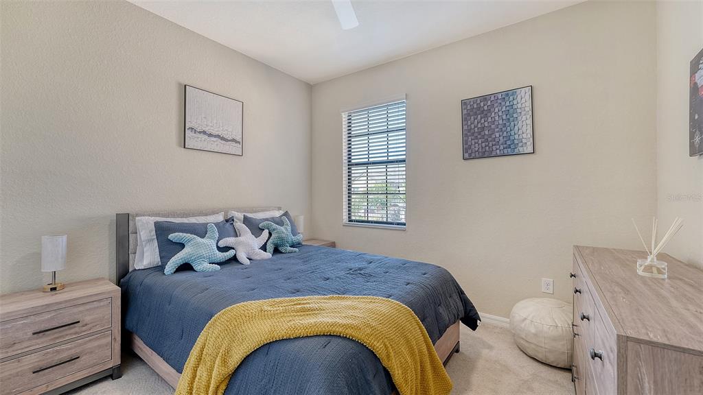 20223 Lagente Circle Venice, FL 34293 - Photo 29 of 71 a bedroom with a bed and wooden floor