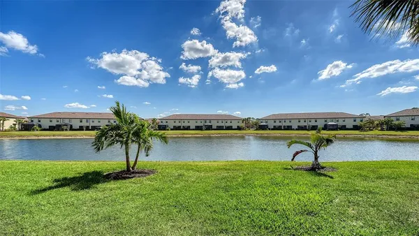 a view of a swimming pool with an outdoor space and seating area