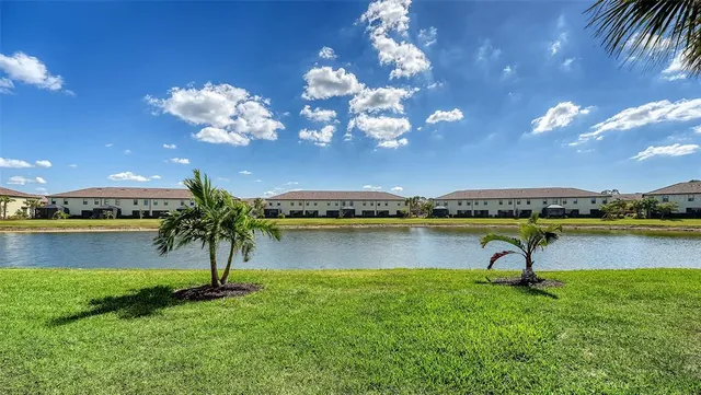 a view of a swimming pool with an outdoor space and seating area
