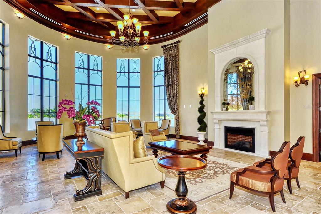 20223 Lagente Circle Venice, FL 34293 - Photo 46 of 71 a living room with furniture a chandelier and a fireplace