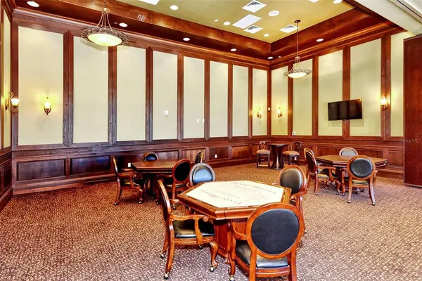 a multi story building with trees in front of it