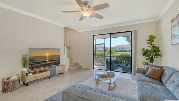 a living room with furniture and a large window