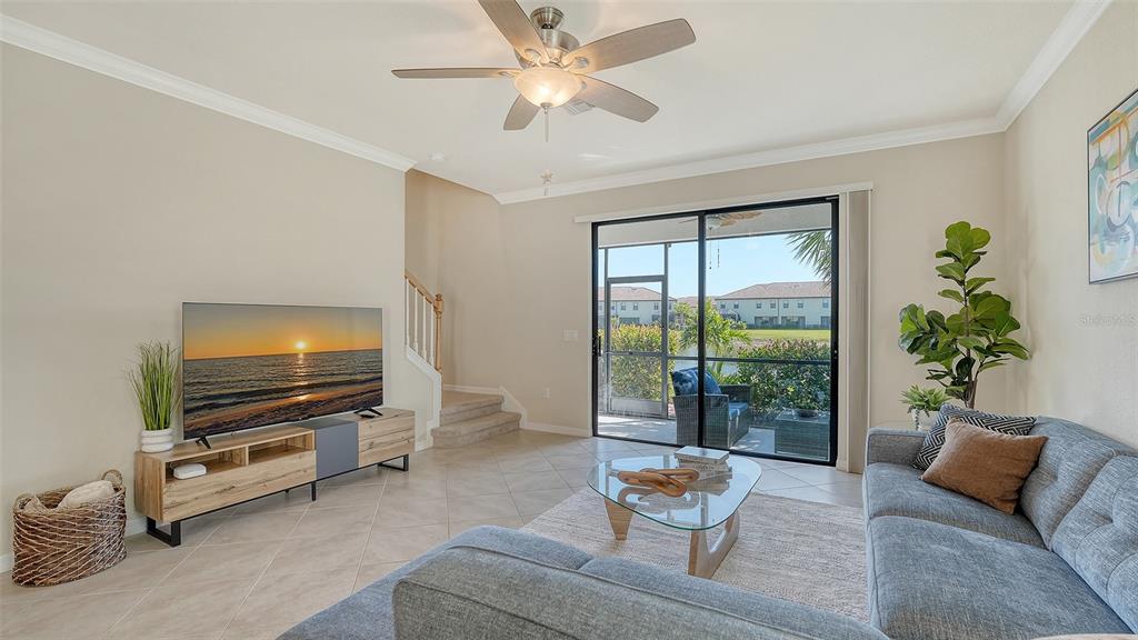 20223 Lagente Circle Venice, FL 34293 - Photo 5 of 71 a living room with furniture and a flat screen tv