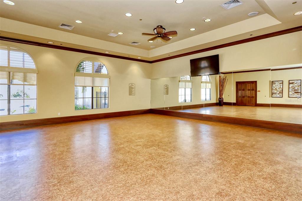 20223 Lagente Circle Venice, FL 34293 - Photo 65 of 71 an empty room with windows and ceiling fan