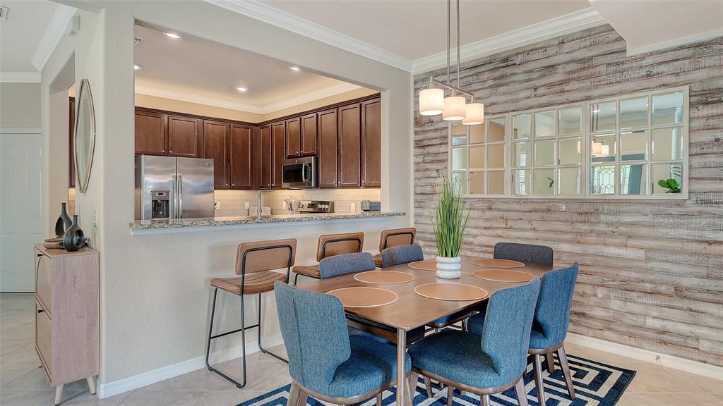 20223 Lagente Circle Venice, FL 34293 - Photo 9 of 71 a view of a dining room with furniture window and outside view