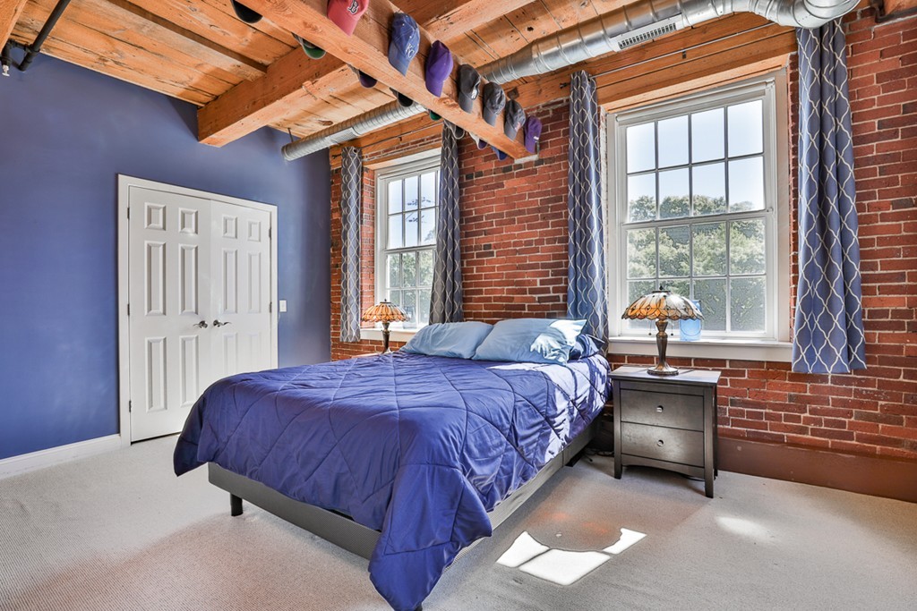 25 Cedar Street, Unit 4 Amesbury, MA 01913 - Photo 12 of 20 a bedroom with a bed and a window
