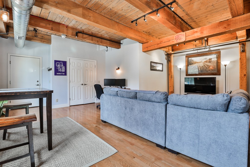 25 Cedar Street, Unit 4 Amesbury, MA 01913 - Photo 6 of 20 a living room with furniture and a wooden floor