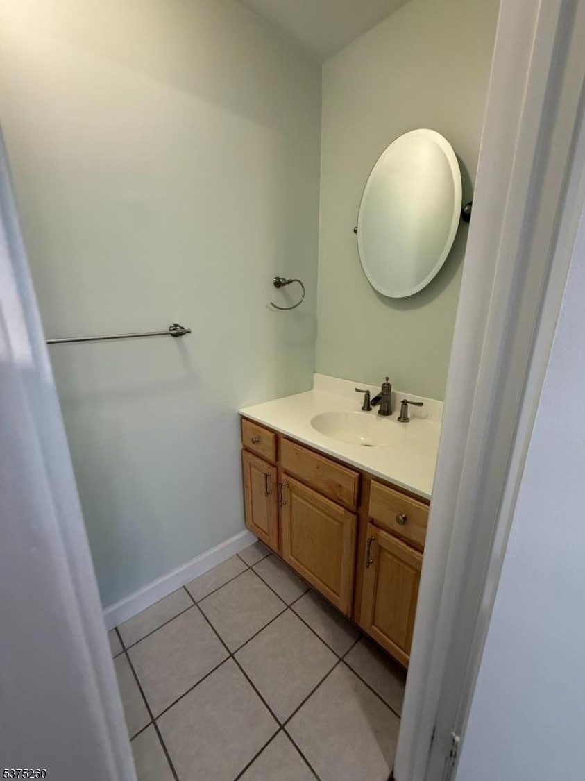 606 Nottingham Way Flemington, NJ 08822 - Photo 4 of 17 a spacious bathroom with a mirror and a sink