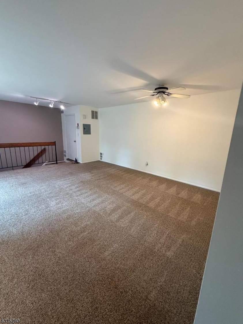 606 Nottingham Way Flemington, NJ 08822 - Photo 9 of 17 an empty room with a projector and a projector