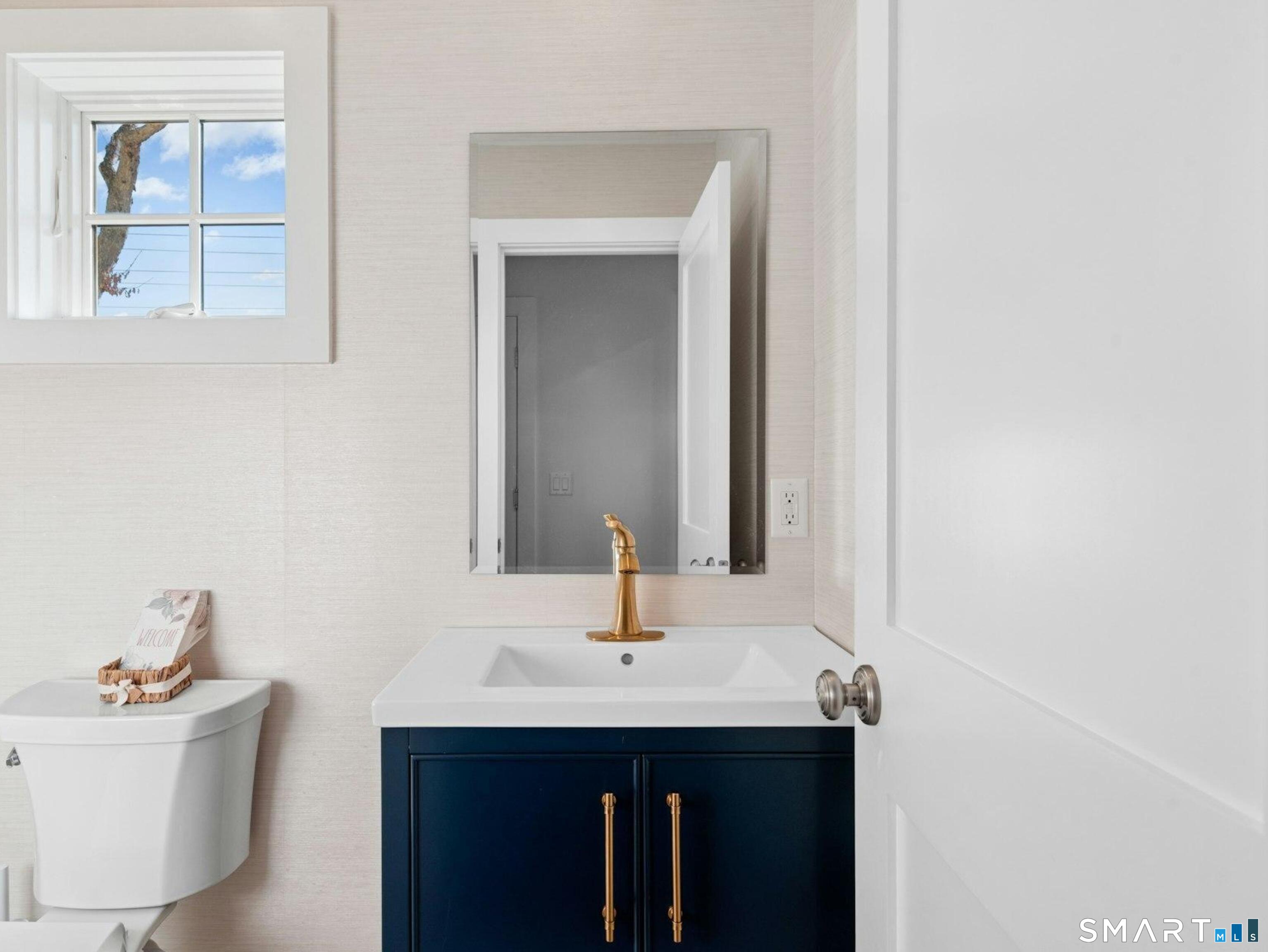 13 Patton Drive Darien, CT 06820 - Photo 13 of 26 a bathroom with a sink and a mirror