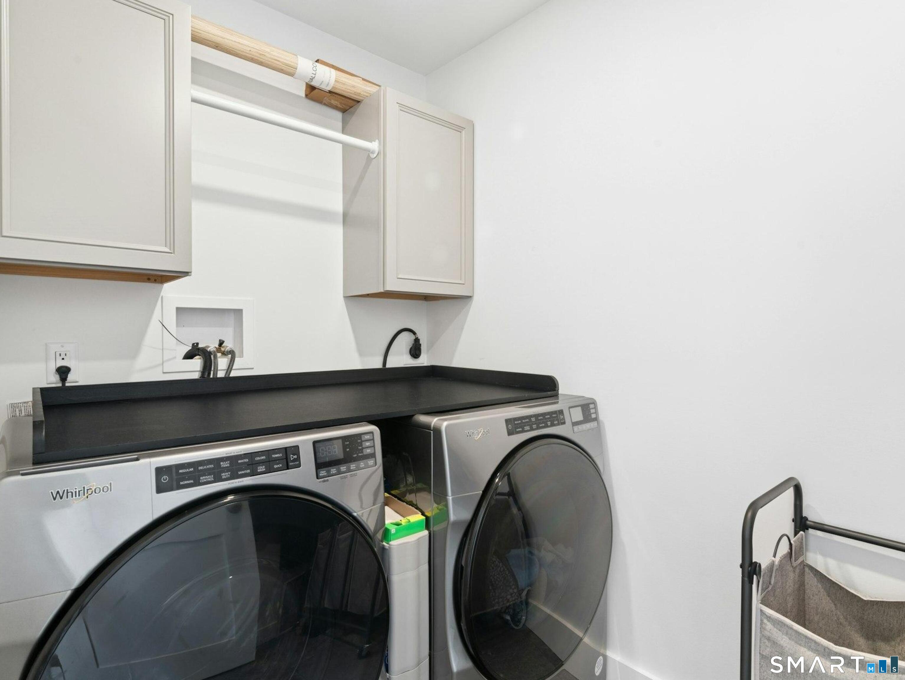 13 Patton Drive Darien, CT 06820 - Photo 14 of 26 a utility room with sink dryer and washer