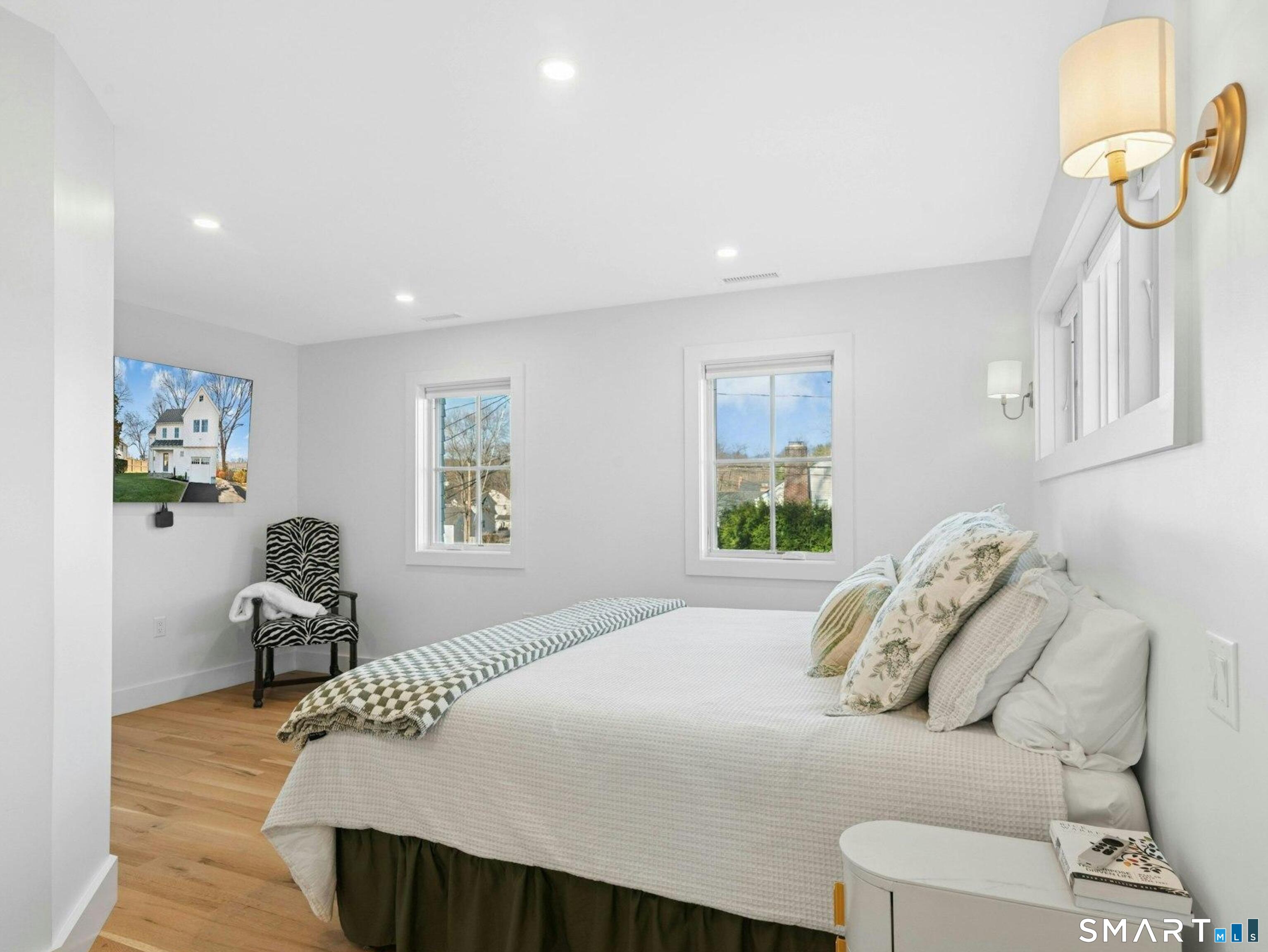 13 Patton Drive Darien, CT 06820 - Photo 15 of 26 a bedroom with a bed and window