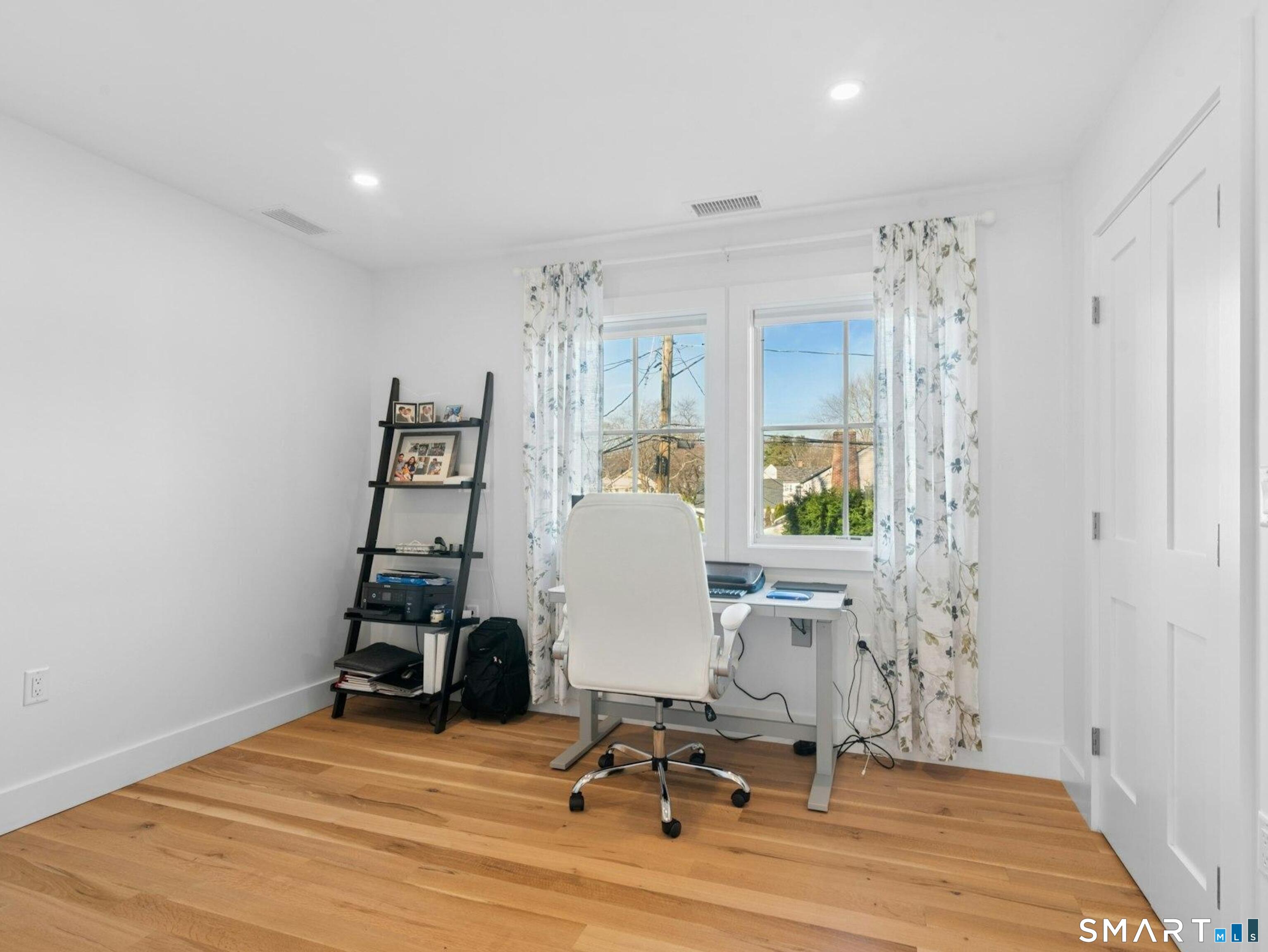 13 Patton Drive Darien, CT 06820 - Photo 21 of 26 a view of a workspace with furniture and a window