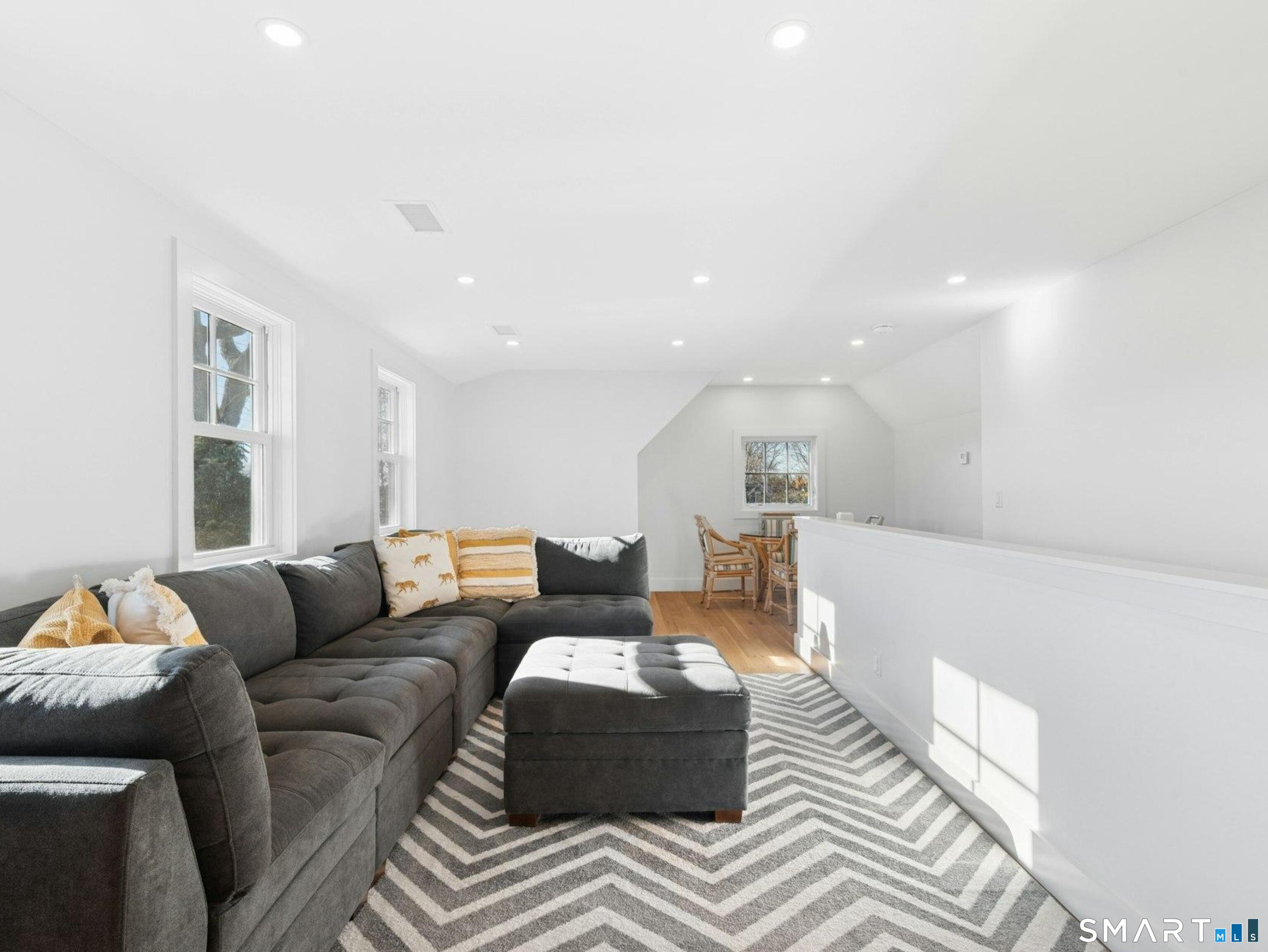13 Patton Drive Darien, CT 06820 - Photo 23 of 26 a living room with furniture and a couch