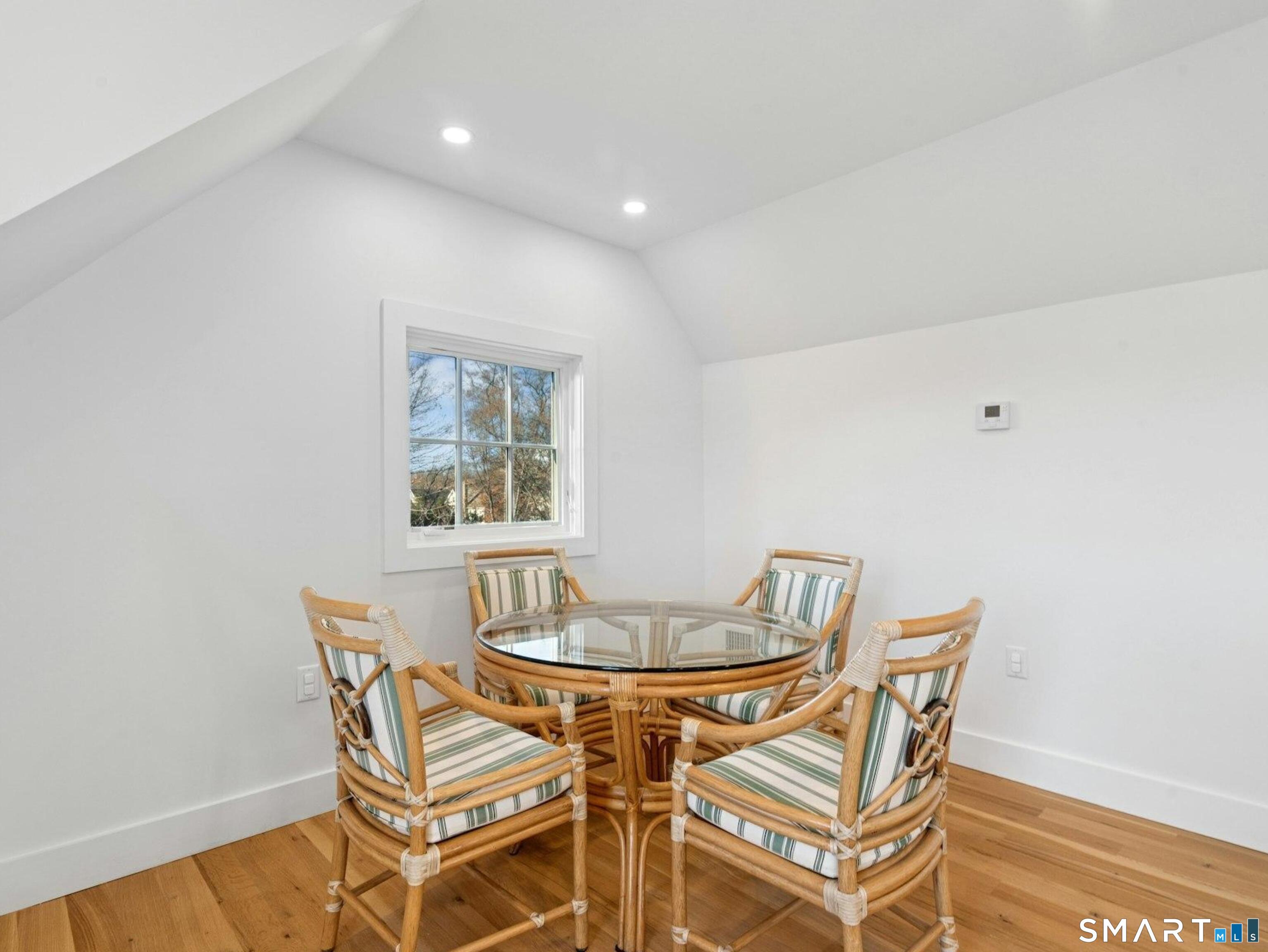 13 Patton Drive Darien, CT 06820 - Photo 24 of 26 a dining room with a table and chairs
