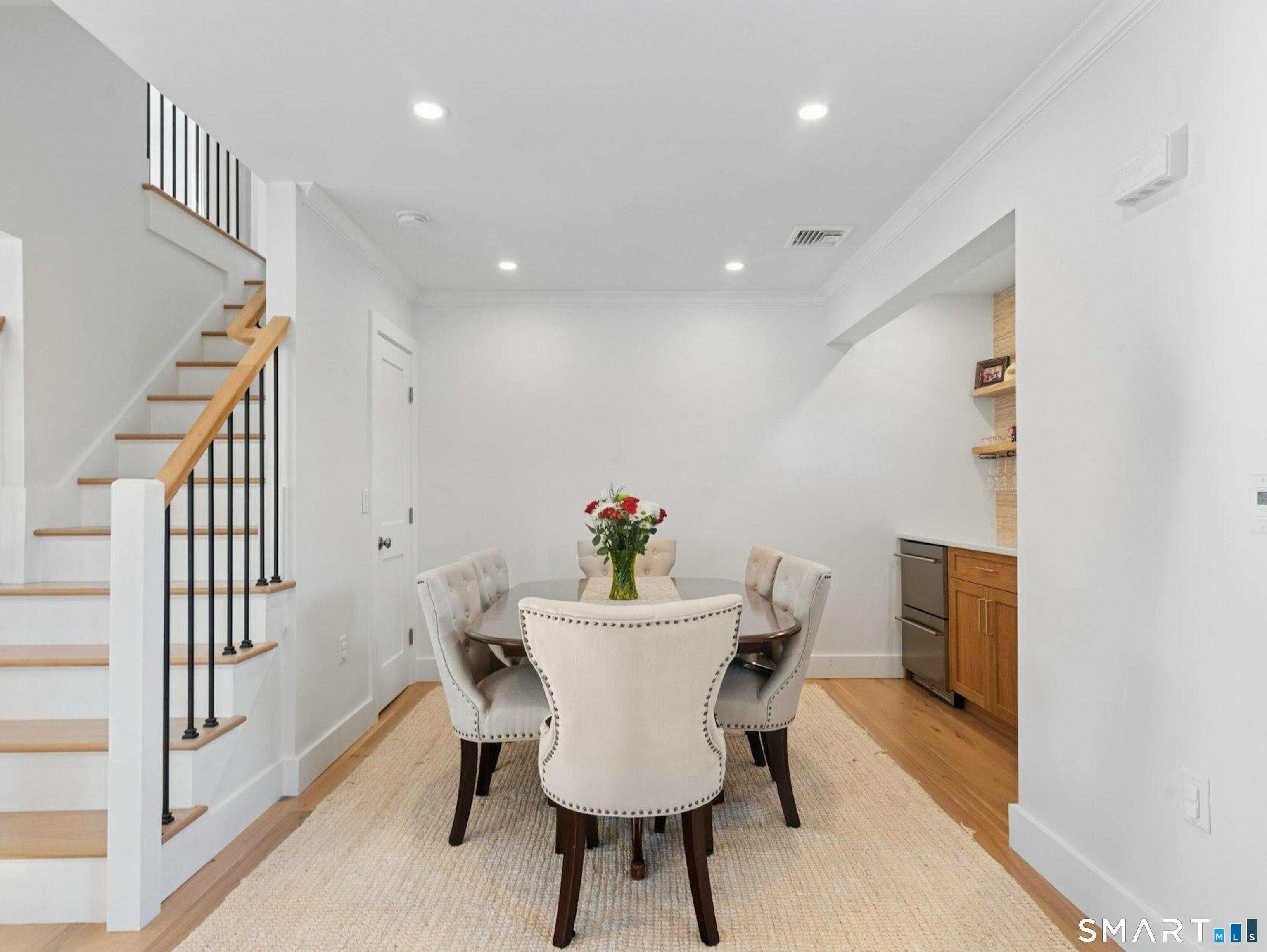 13 Patton Drive Darien, CT 06820 - Photo 6 of 26 a view of a dining room with furniture and wooden floor