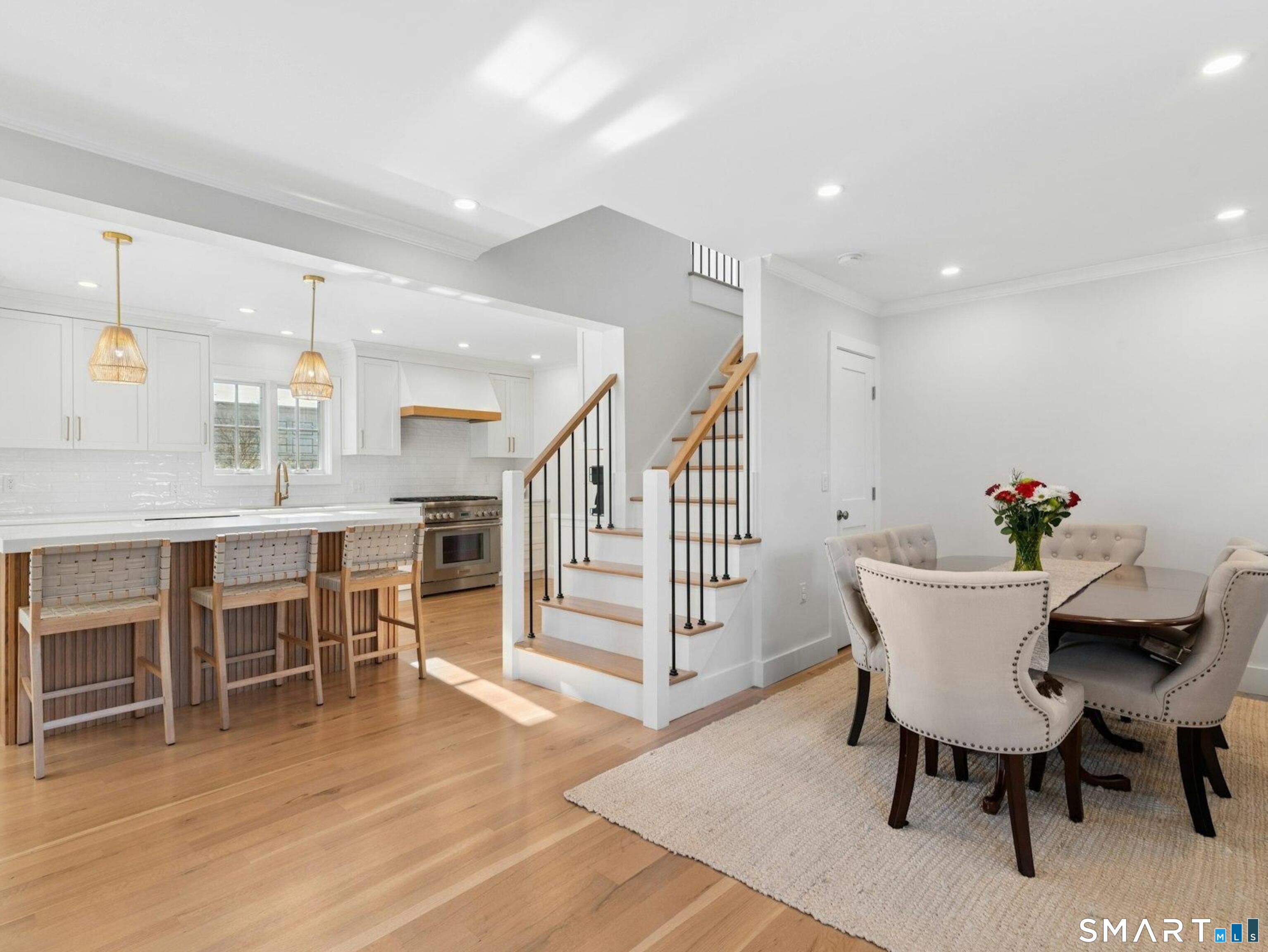 13 Patton Drive Darien, CT 06820 - Photo 7 of 26 a view of a dining room with furniture and wooden floor