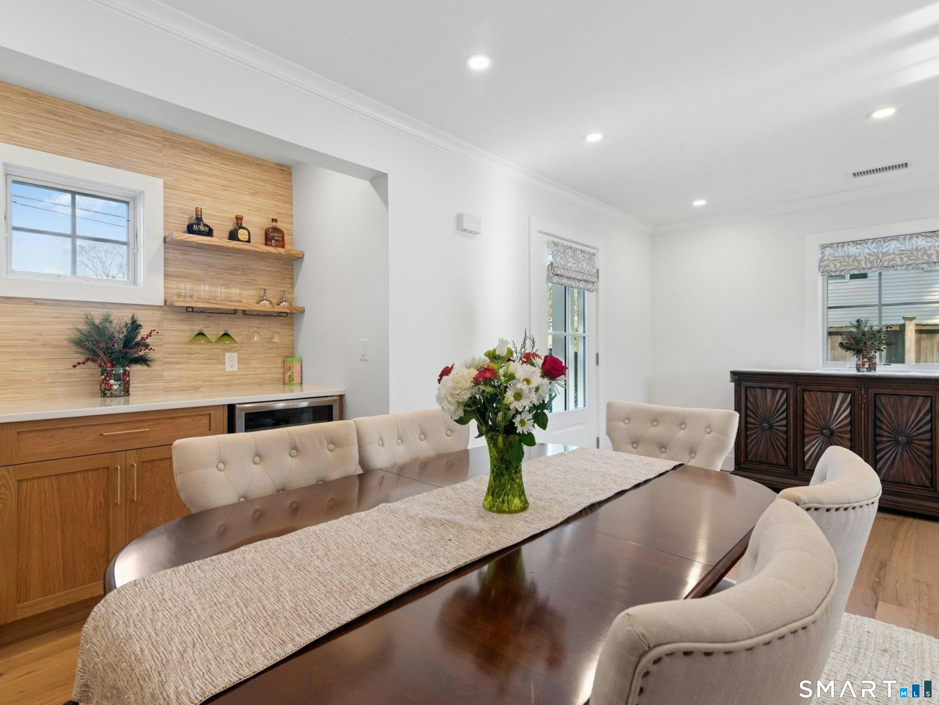13 Patton Drive Darien, CT 06820 - Photo 8 of 26 a living room with furniture flowers and flowers