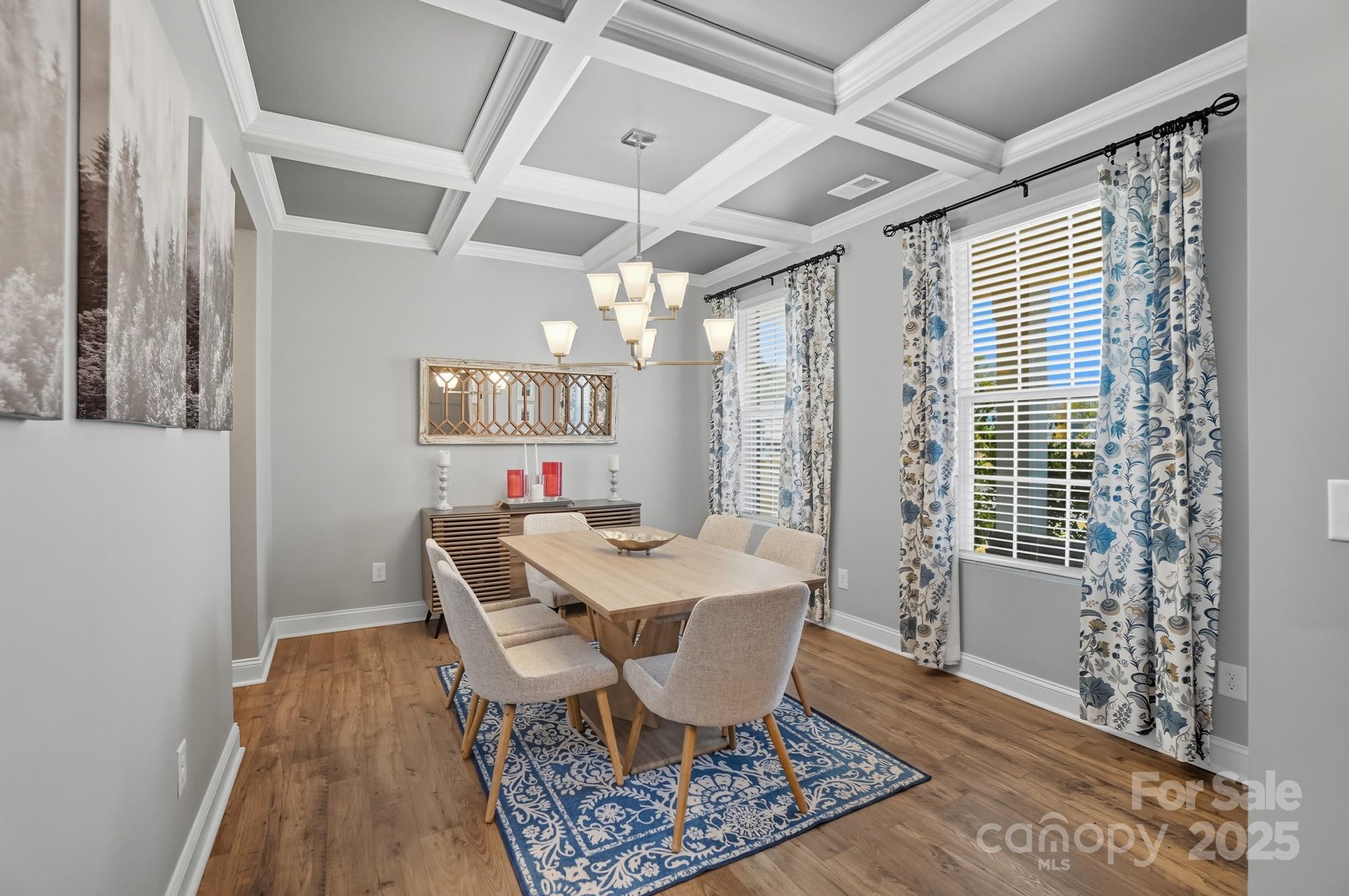 1325 Black Walnut Street Monroe, NC 28112 - Photo 11 of 46 a view of a dining room with furniture and wooden floor