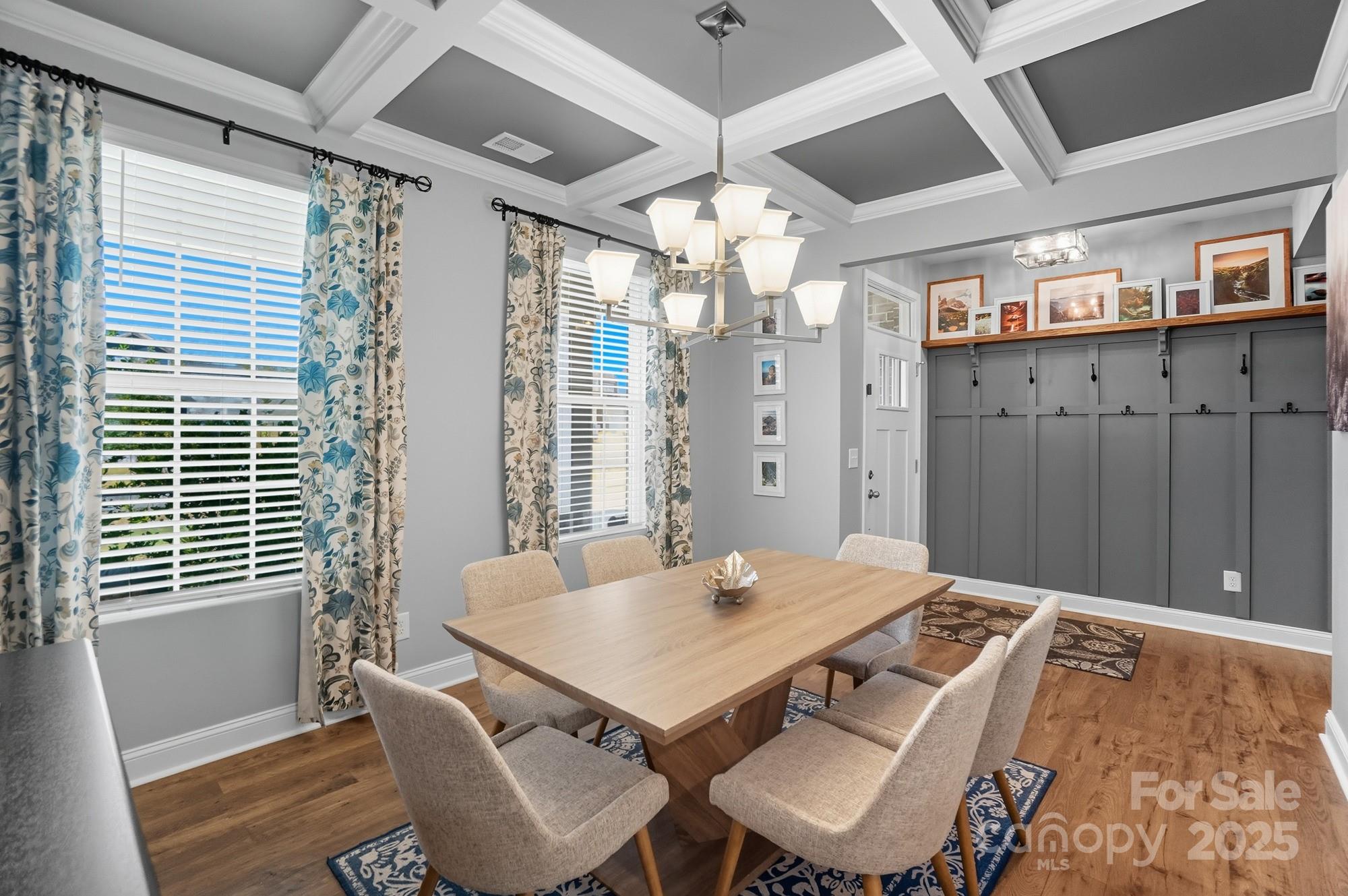 1325 Black Walnut Street Monroe, NC 28112 - Photo 12 of 46 a view of a dining room with furniture and a chandelier