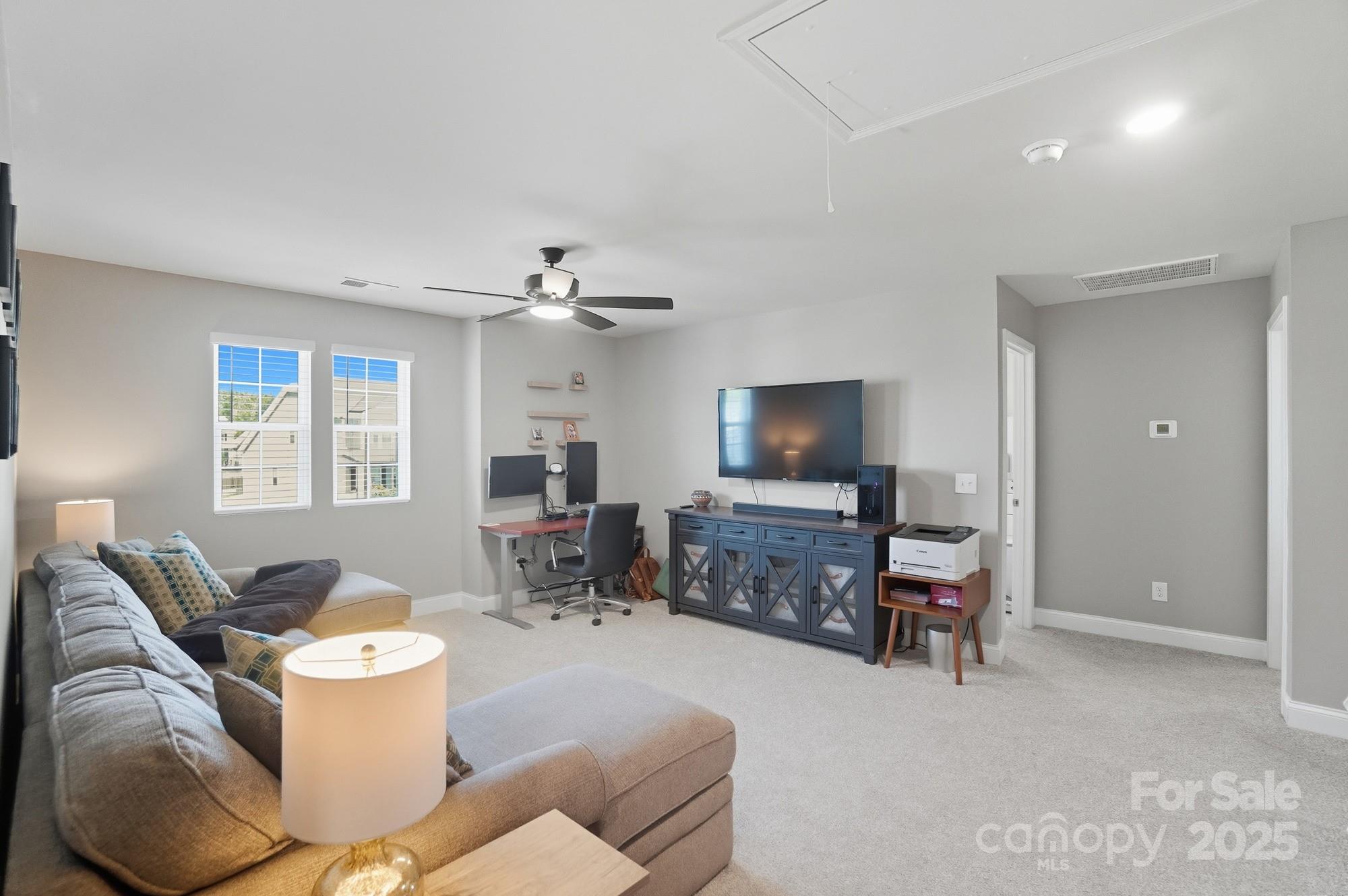 1325 Black Walnut Street Monroe, NC 28112 - Photo 28 of 46 a living room with furniture and a flat screen tv