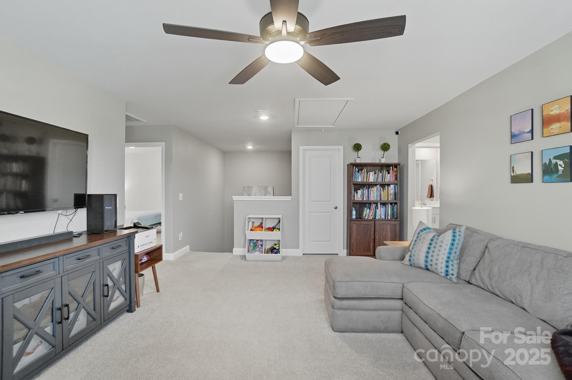 1325 Black Walnut Street Monroe, NC 28112 - Photo 29 of 46 a living room with furniture and a flat screen tv