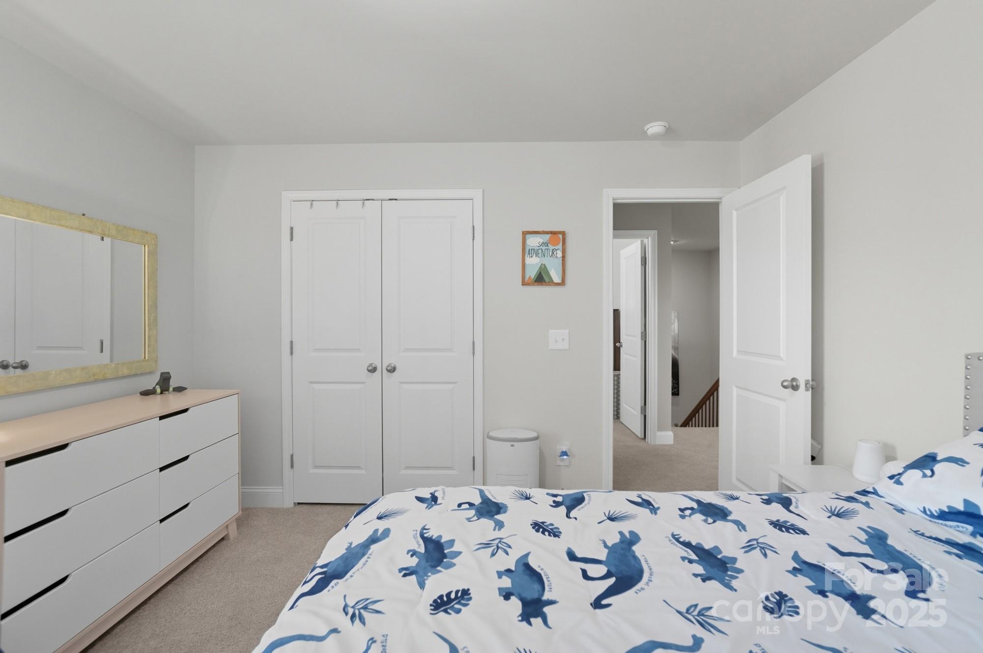 1325 Black Walnut Street Monroe, NC 28112 - Photo 32 of 46 a bedroom with a bed and a bathroom