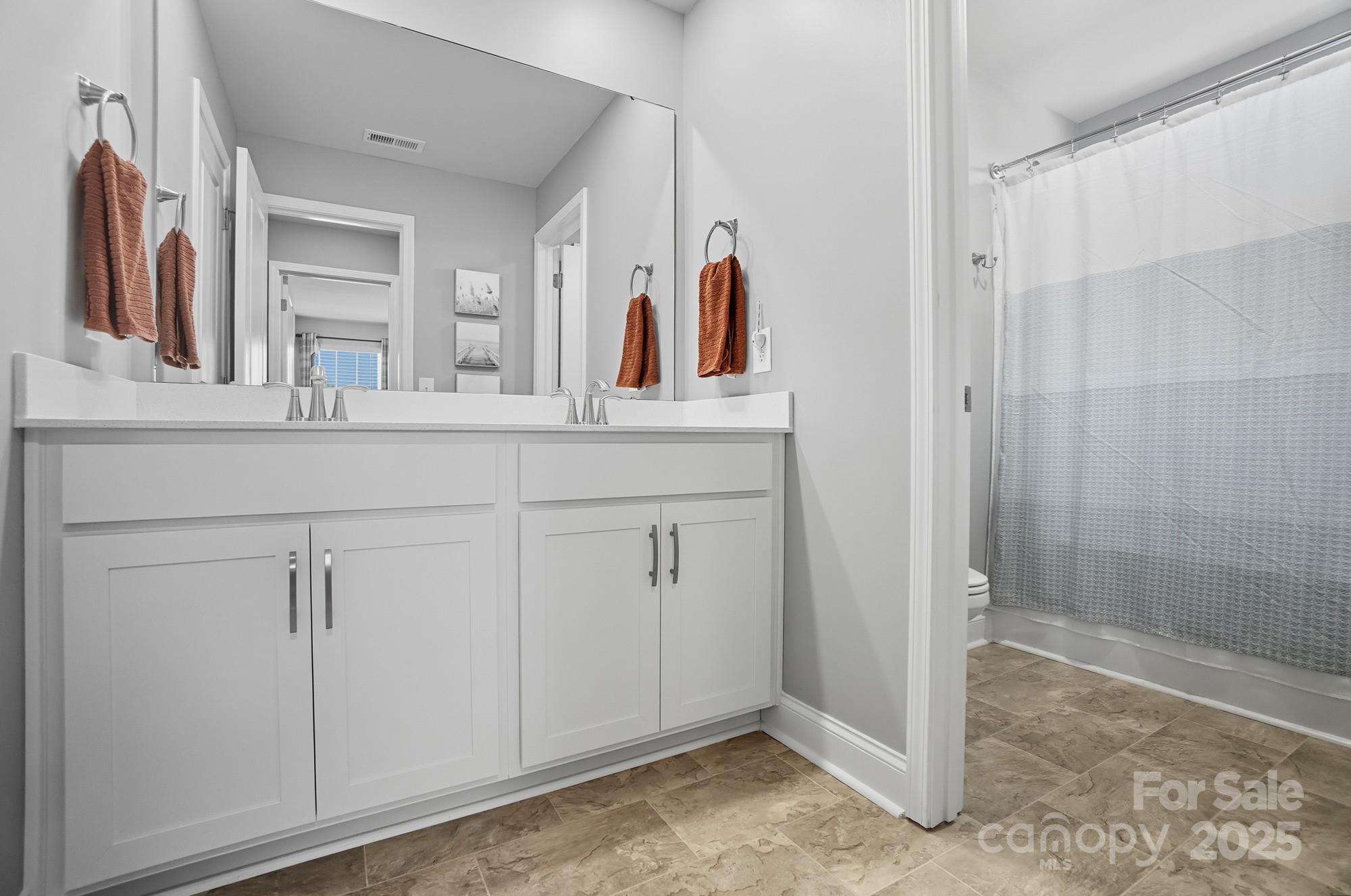 1325 Black Walnut Street Monroe, NC 28112 - Photo 35 of 46 a bathroom with a double vanity sink and mirror